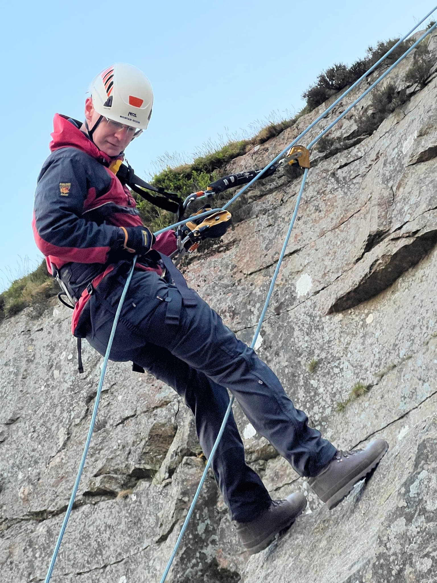 A team member practices ropes skills