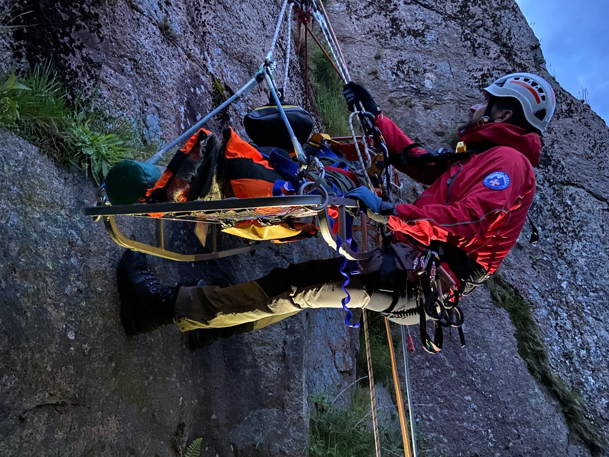 Stretcher being moved using a rope system