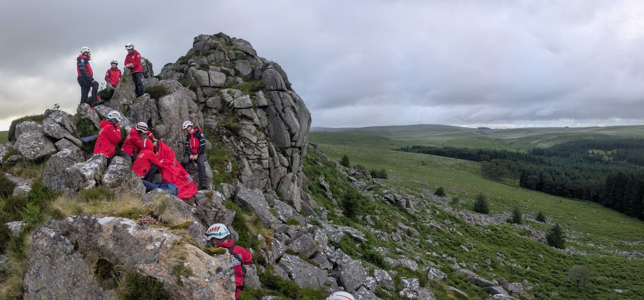 AI illustration of four rescue volunteers planning a route together on Dartmoor