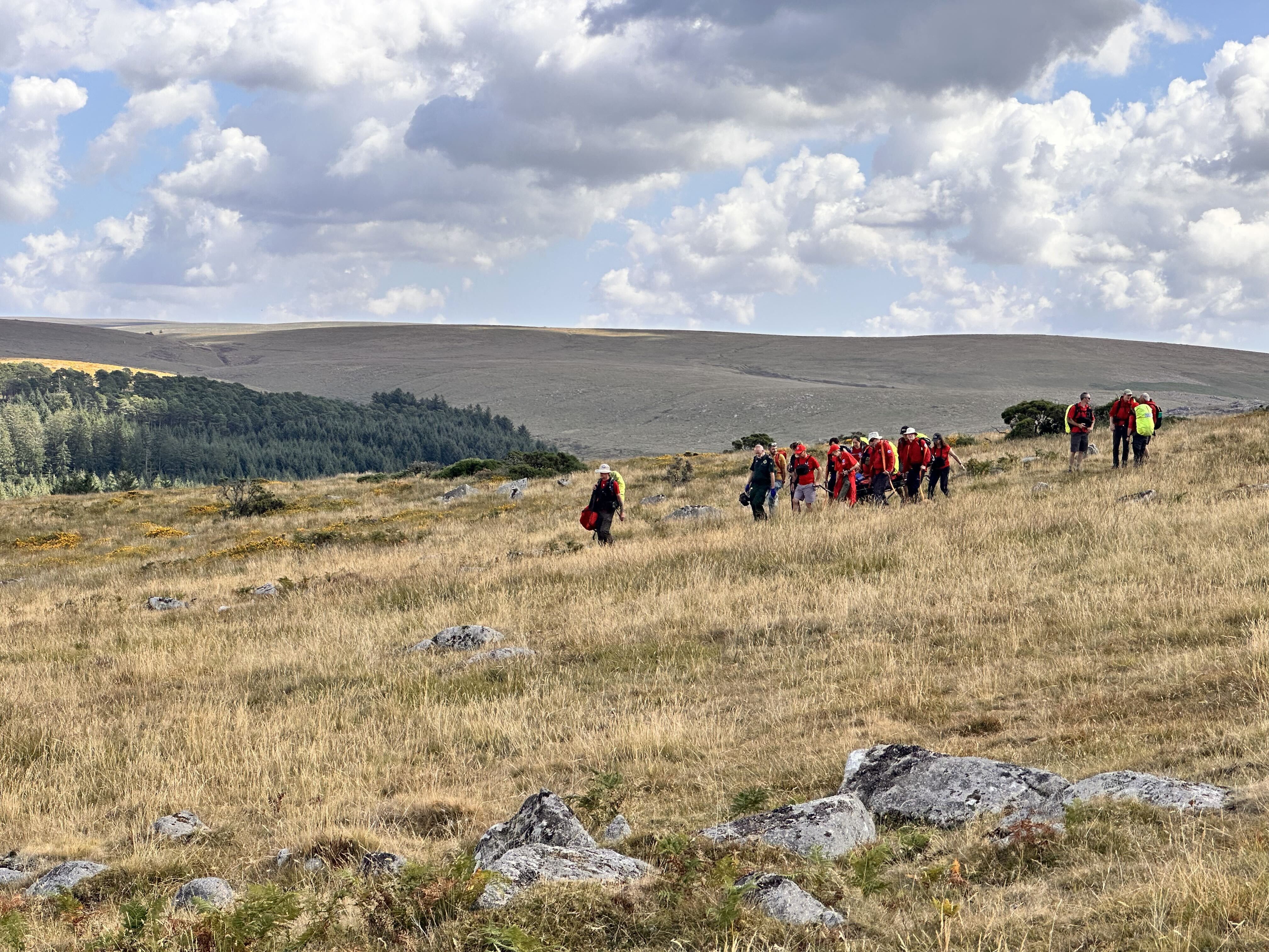 Team members carry the casualty to the ambulance in our Titan stretcher