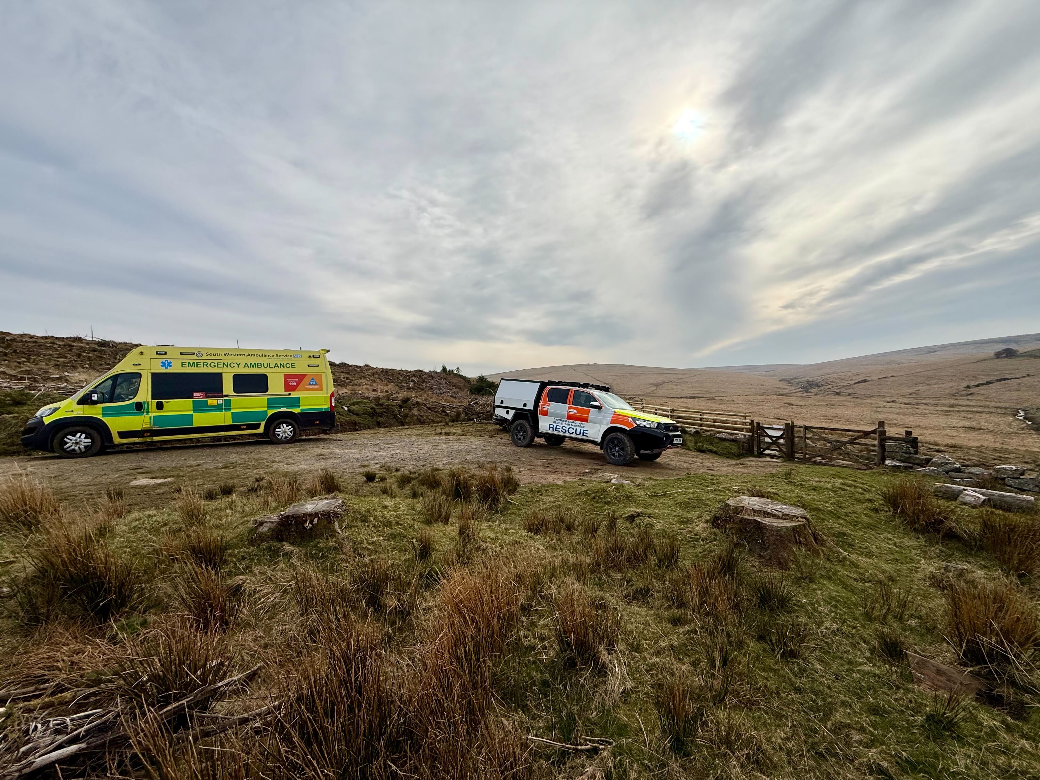 63 posing with an Ambulance